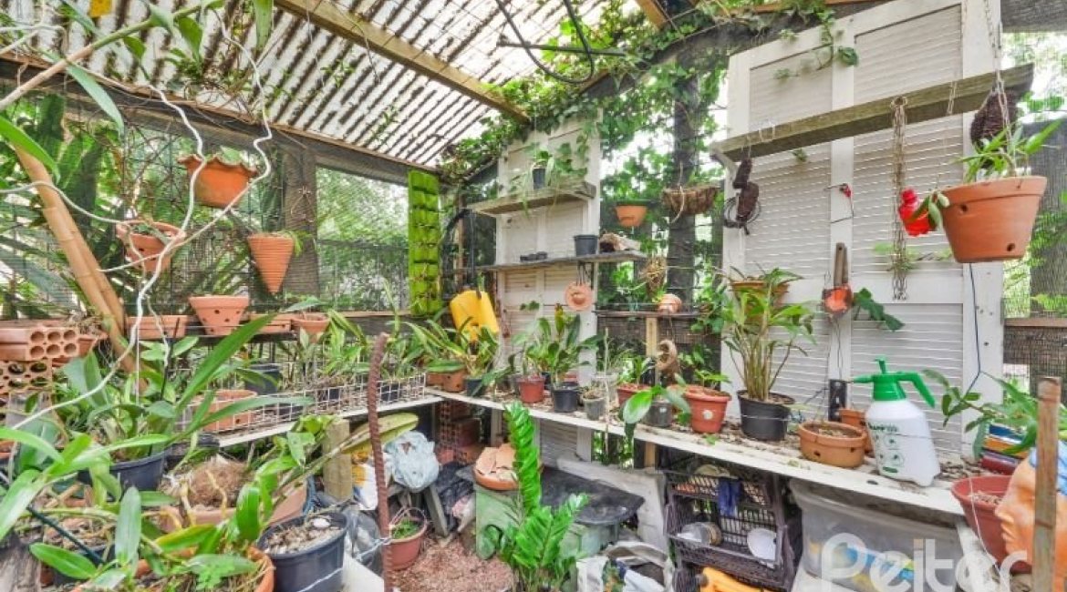 Casa em Condomínio à venda com 389m², 4 dormitórios, 3 suítes, 4 vagas, no bairro Vila Nova em Porto Alegre