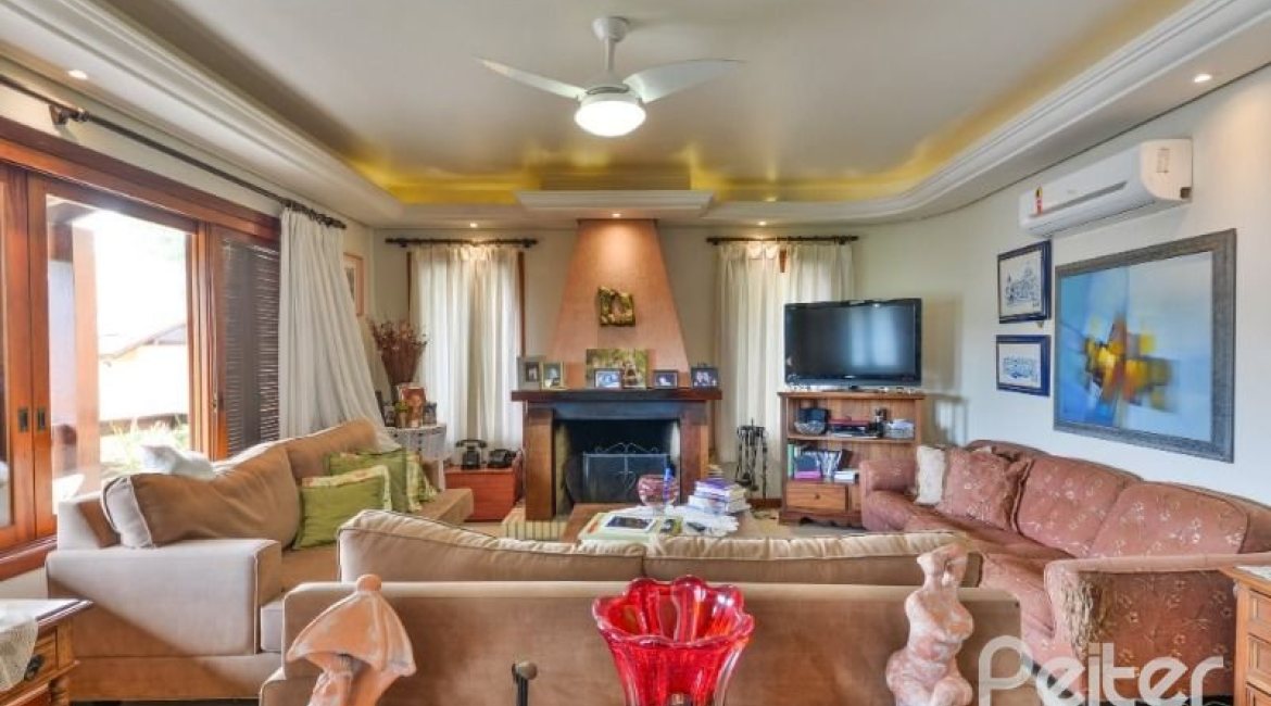 Casa em Condomínio à venda com 389m², 4 dormitórios, 3 suítes, 4 vagas, no bairro Vila Nova em Porto Alegre