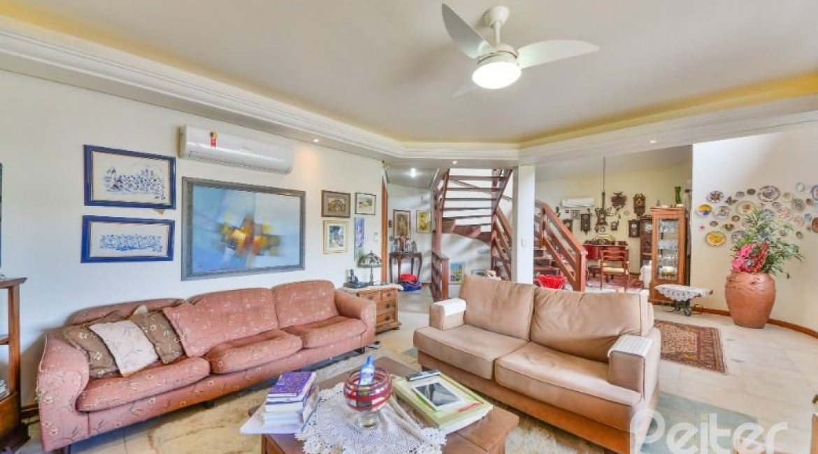 Casa em Condomínio à venda com 389m², 4 dormitórios, 3 suítes, 4 vagas, no bairro Vila Nova em Porto Alegre