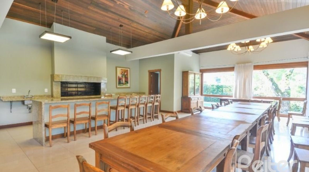 Casa em Condomínio à venda com 500m², 4 dormitórios, 4 suítes, 3 vagas, no bairro Vila Assunção em Porto Alegre