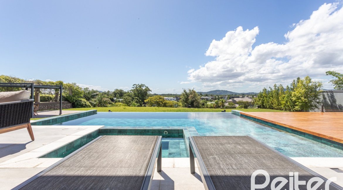 Casa em Condomínio à venda com 608m², 5 dormitórios, 5 suítes, 3 vagas, no bairro Terra Ville em PORTO ALEGRE