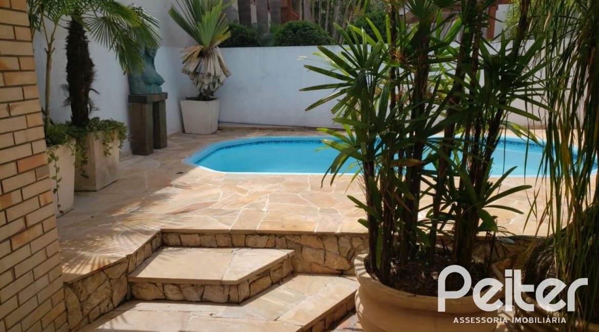 Casa em Condomínio à venda com 300m², 3 dormitórios, 3 suítes, 3 vagas, no bairro Ipanema em Porto Alegre