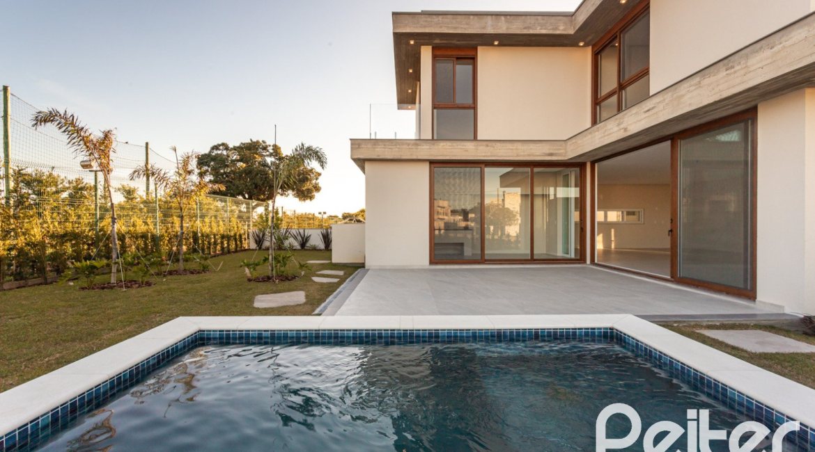 Casa em Condomínio à venda com 400m², 3 dormitórios, 3 suítes, 4 vagas, no bairro Alphaville em PORTO ALEGRE