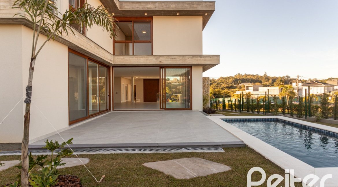 Casa em Condomínio à venda com 400m², 3 dormitórios, 3 suítes, 4 vagas, no bairro Alphaville em PORTO ALEGRE