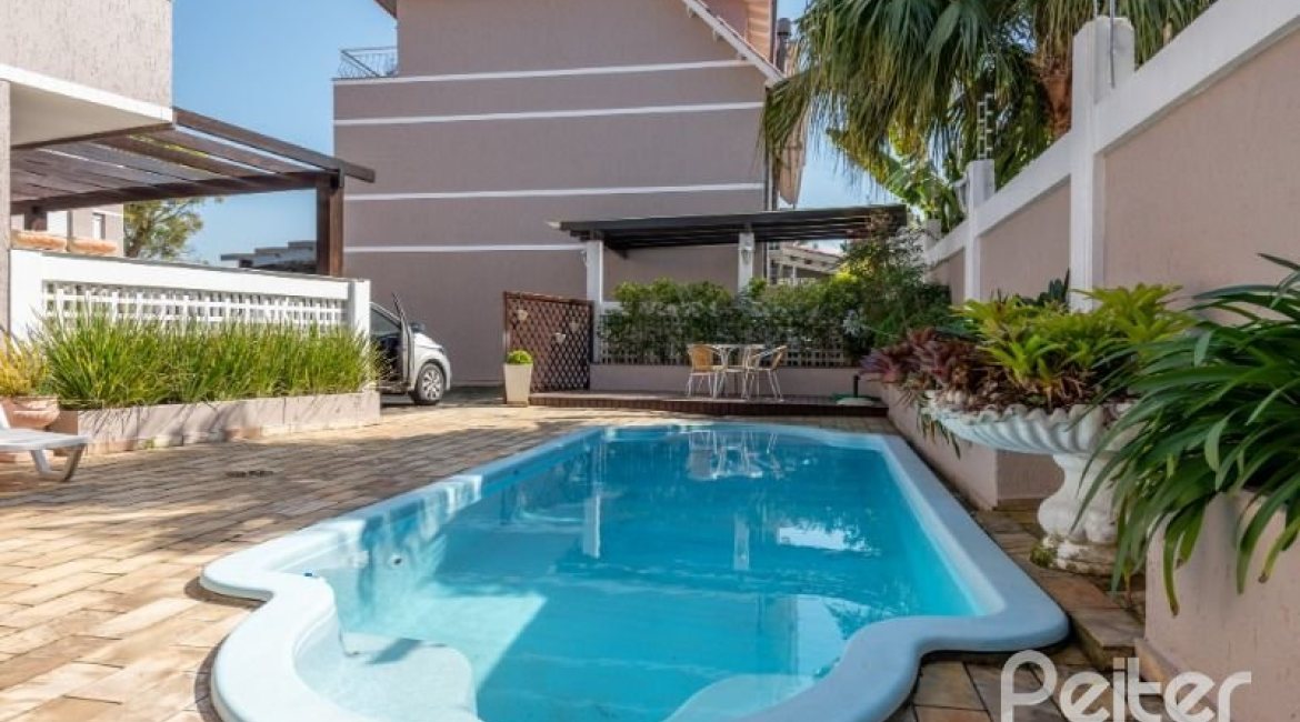 Casa em Condomínio à venda com 162m², 3 dormitórios, 1 suíte, 2 vagas, no bairro Vila Assunção em PORTO ALEGRE