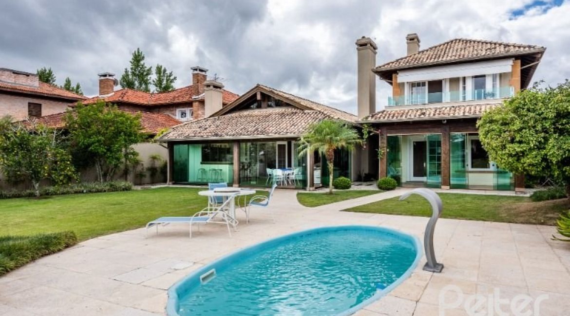 Casa em Condomínio à venda com 449m², 3 dormitórios, 3 suítes, 6 vagas, no bairro Terra Ville em PORTO ALEGRE