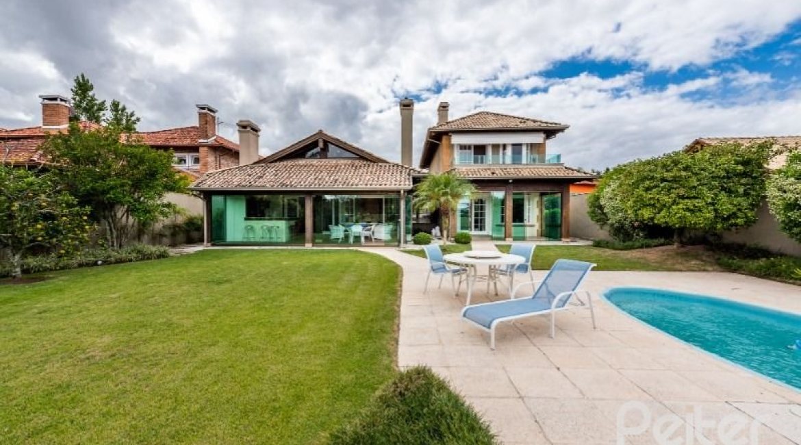 Casa em Condomínio à venda com 449m², 3 dormitórios, 3 suítes, 6 vagas, no bairro Terra Ville em PORTO ALEGRE