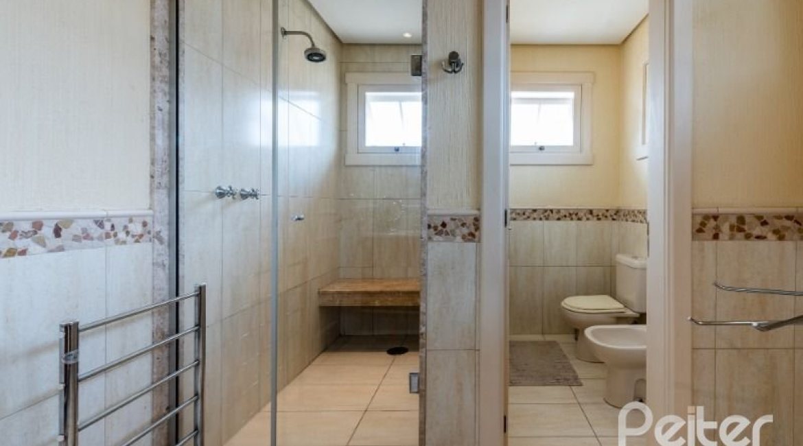 Casa em Condomínio à venda com 449m², 3 dormitórios, 3 suítes, 6 vagas, no bairro Terra Ville em PORTO ALEGRE