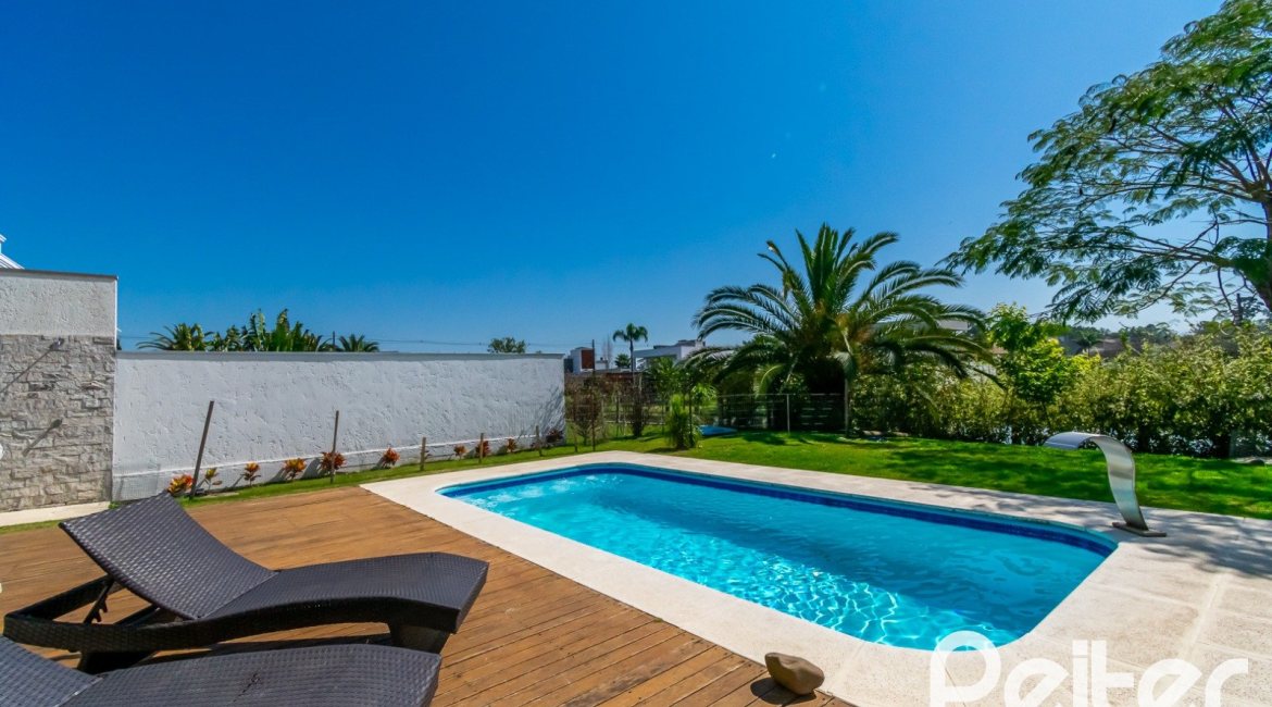 Casa em Condomínio à venda com 420m², 4 dormitórios, 4 suítes, 6 vagas, no bairro Terra Ville em PORTO ALEGRE