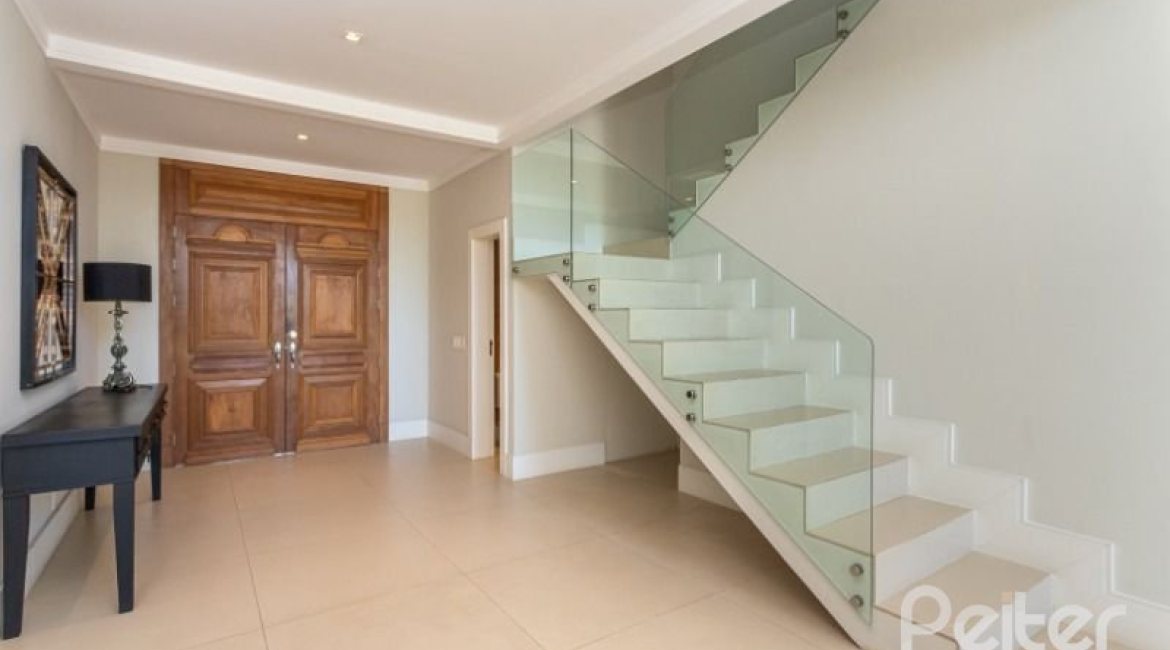 Casa em Condomínio à venda com 550m², 3 dormitórios, 3 suítes, 4 vagas, no bairro Terra Ville em PORTO ALEGRE