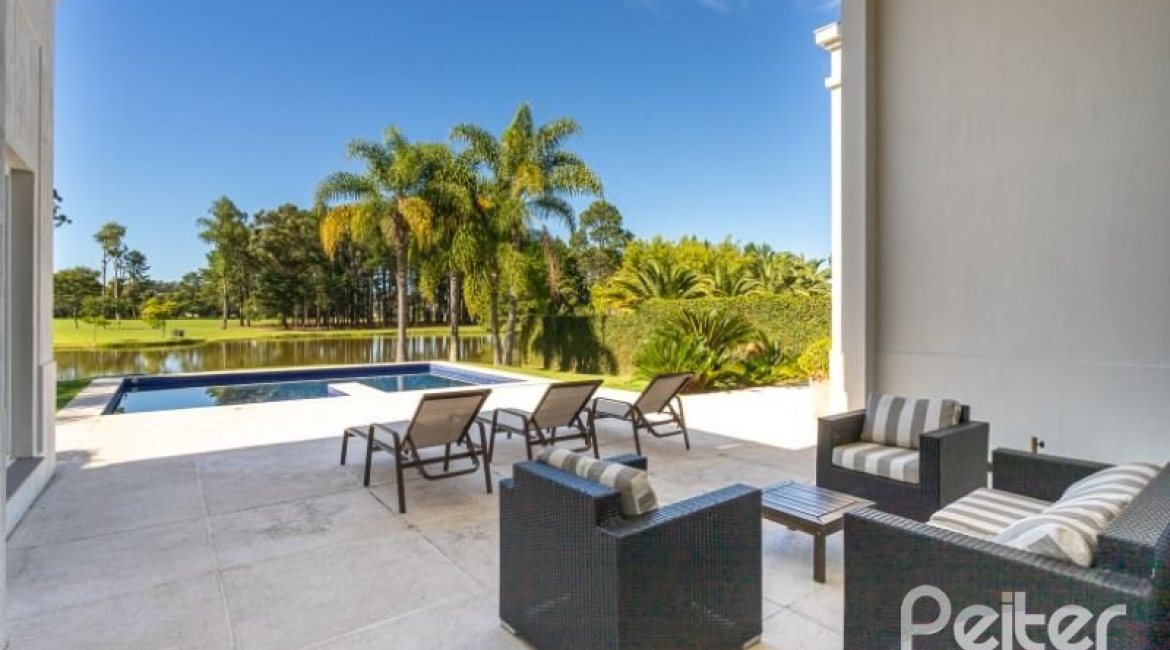 Casa em Condomínio à venda com 550m², 3 dormitórios, 3 suítes, 4 vagas, no bairro Terra Ville em PORTO ALEGRE