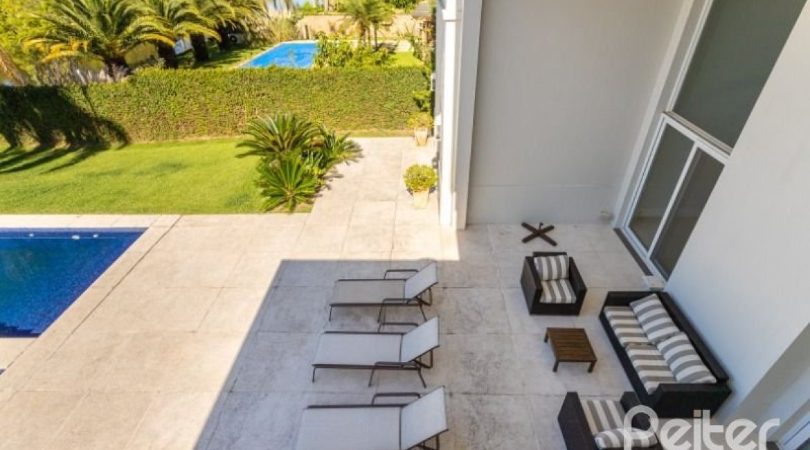 Casa em Condomínio à venda com 550m², 3 dormitórios, 3 suítes, 4 vagas, no bairro Terra Ville em PORTO ALEGRE