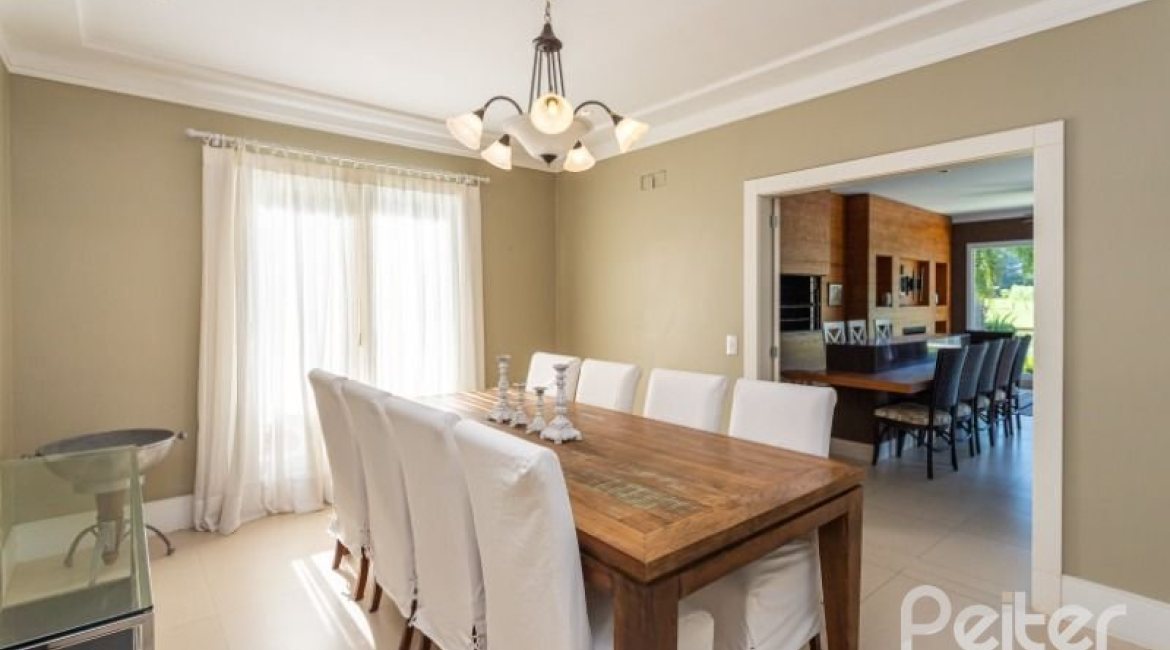 Casa em Condomínio à venda com 550m², 3 dormitórios, 3 suítes, 4 vagas, no bairro Terra Ville em PORTO ALEGRE