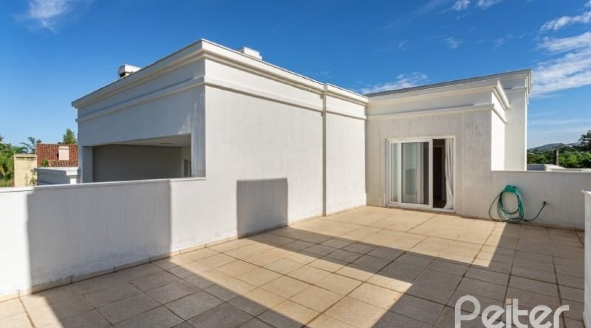 Casa em Condomínio à venda com 550m², 3 dormitórios, 3 suítes, 4 vagas, no bairro Terra Ville em PORTO ALEGRE