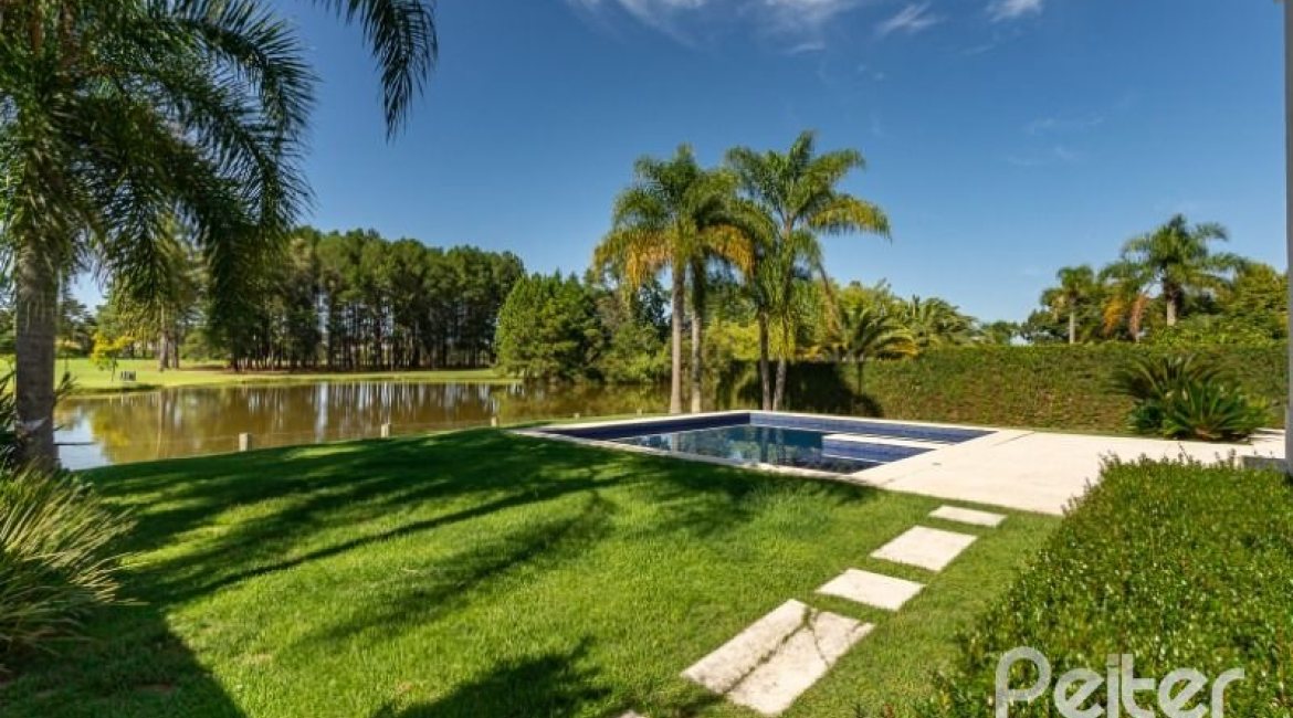 Casa em Condomínio à venda com 550m², 3 dormitórios, 3 suítes, 4 vagas, no bairro Terra Ville em PORTO ALEGRE