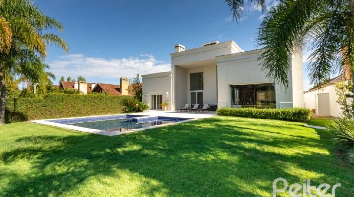 Casa em Condomínio à venda com 550m², 3 dormitórios, 3 suítes, 4 vagas, no bairro Terra Ville em PORTO ALEGRE