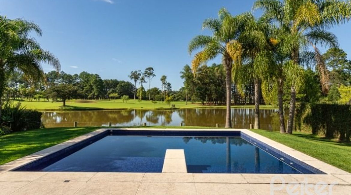Casa em Condomínio à venda com 550m², 3 dormitórios, 3 suítes, 4 vagas, no bairro Terra Ville em PORTO ALEGRE