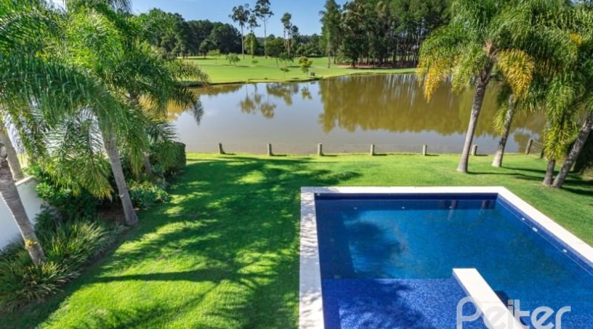 Casa em Condomínio à venda com 550m², 3 dormitórios, 3 suítes, 4 vagas, no bairro Terra Ville em PORTO ALEGRE