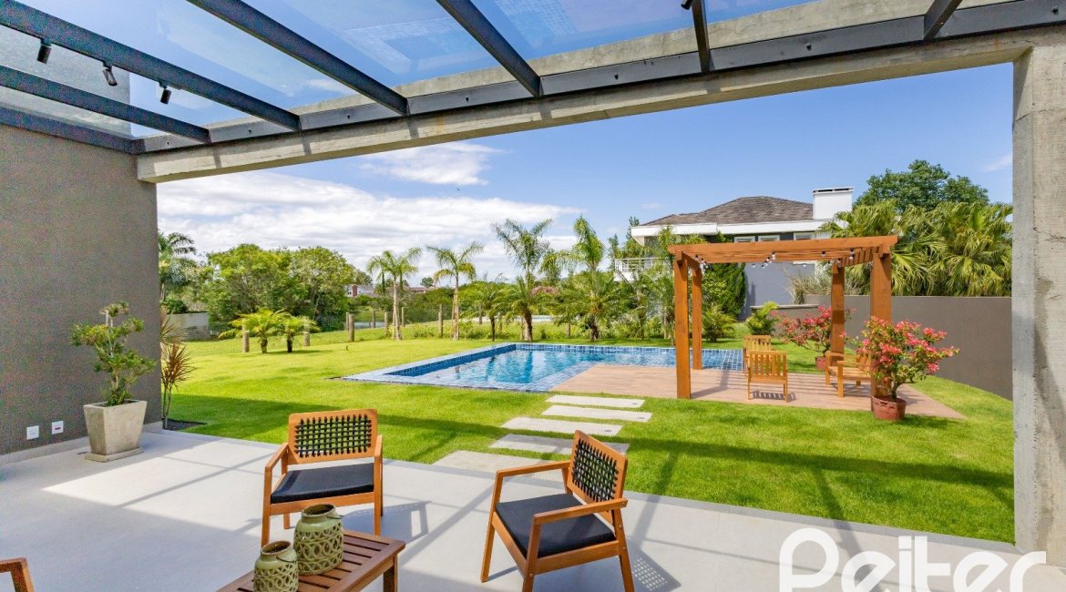 Casa em Condomínio à venda com 370m², 3 dormitórios, 3 suítes, 4 vagas, no bairro Terra Ville em PORTO ALEGRE