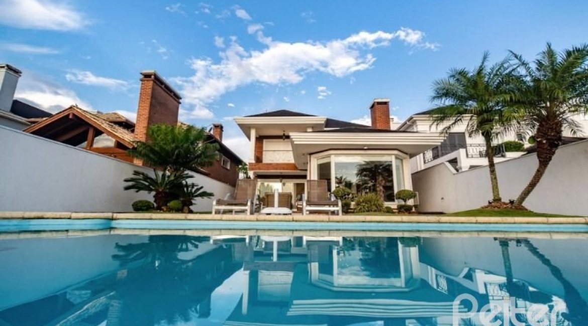 Casa em Condomínio à venda com 338m², 3 dormitórios, 3 suítes, 2 vagas, no bairro Terra Ville em PORTO ALEGRE