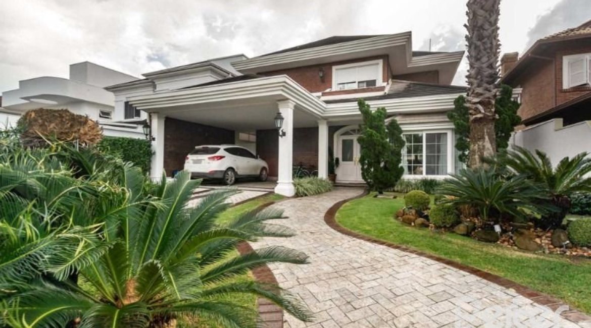 Casa em Condomínio à venda com 338m², 3 dormitórios, 3 suítes, 2 vagas, no bairro Terra Ville em PORTO ALEGRE