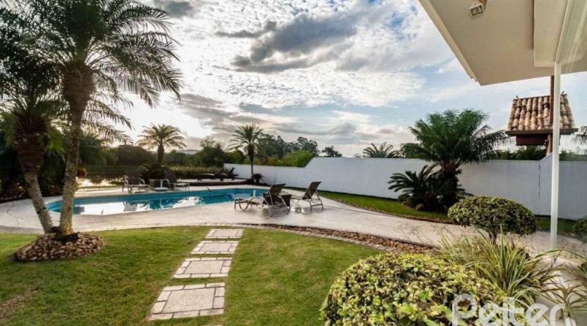 Casa em Condomínio à venda com 338m², 3 dormitórios, 3 suítes, 2 vagas, no bairro Terra Ville em PORTO ALEGRE