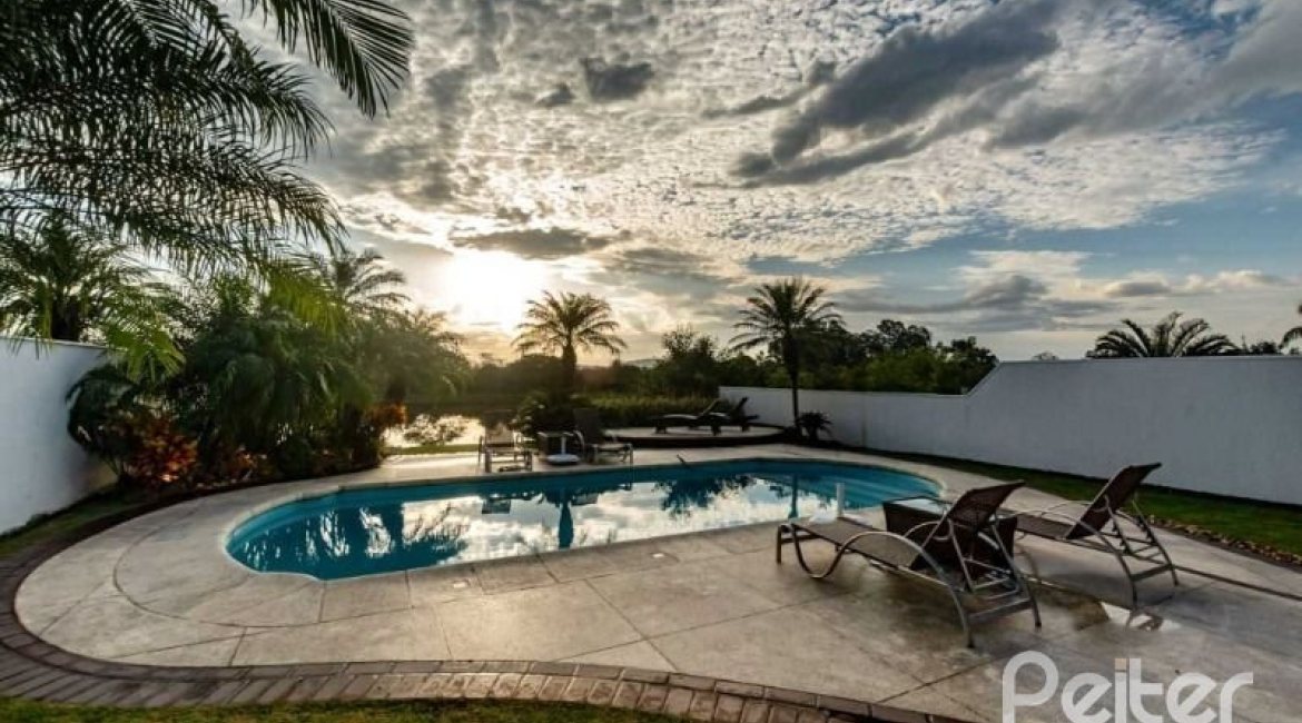 Casa em Condomínio à venda com 338m², 3 dormitórios, 3 suítes, 2 vagas, no bairro Terra Ville em PORTO ALEGRE