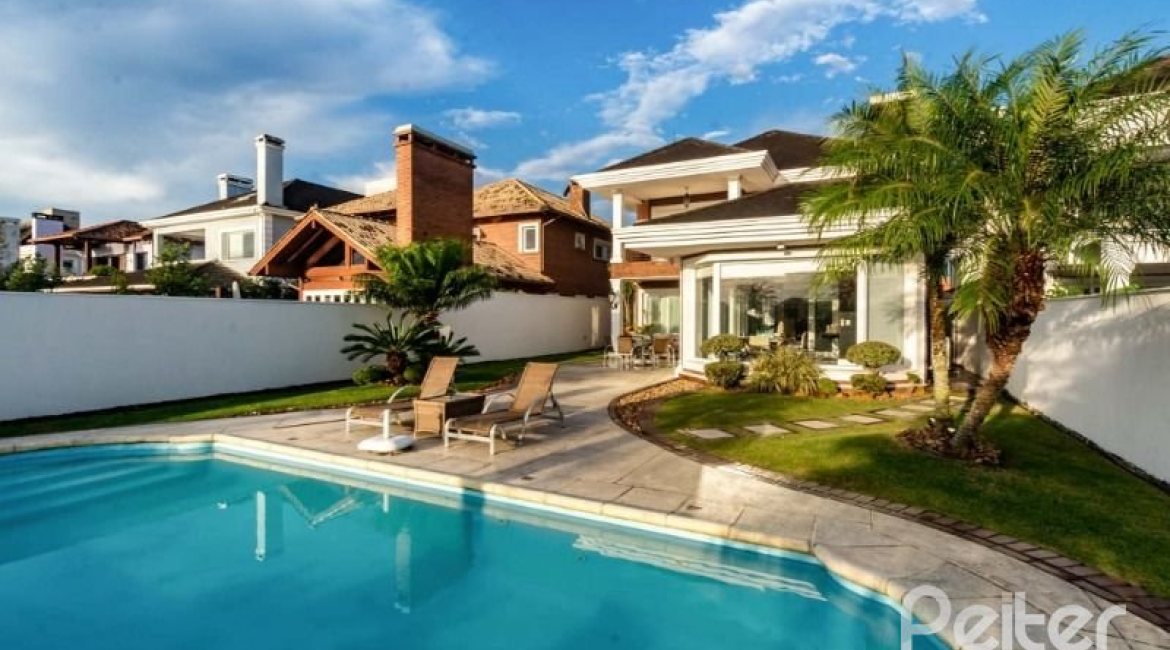 Casa em Condomínio à venda com 338m², 3 dormitórios, 3 suítes, 2 vagas, no bairro Terra Ville em PORTO ALEGRE