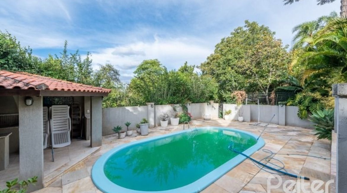 Casa em Condomínio à venda com 320m², 4 dormitórios, 4 suítes, 10 vagas, no bairro Cavalhada em PORTO ALEGRE