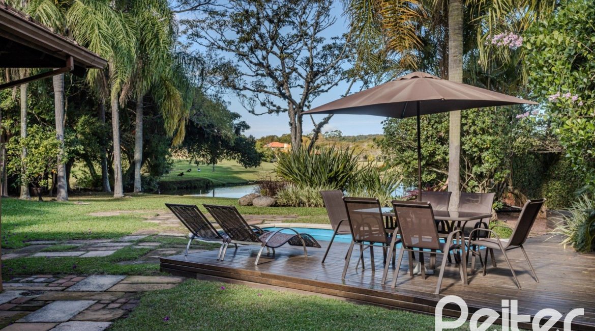 Casa em Condomínio à venda com 450m², 6 dormitórios, 4 suítes, 2 vagas, no bairro Terra Ville em PORTO ALEGRE