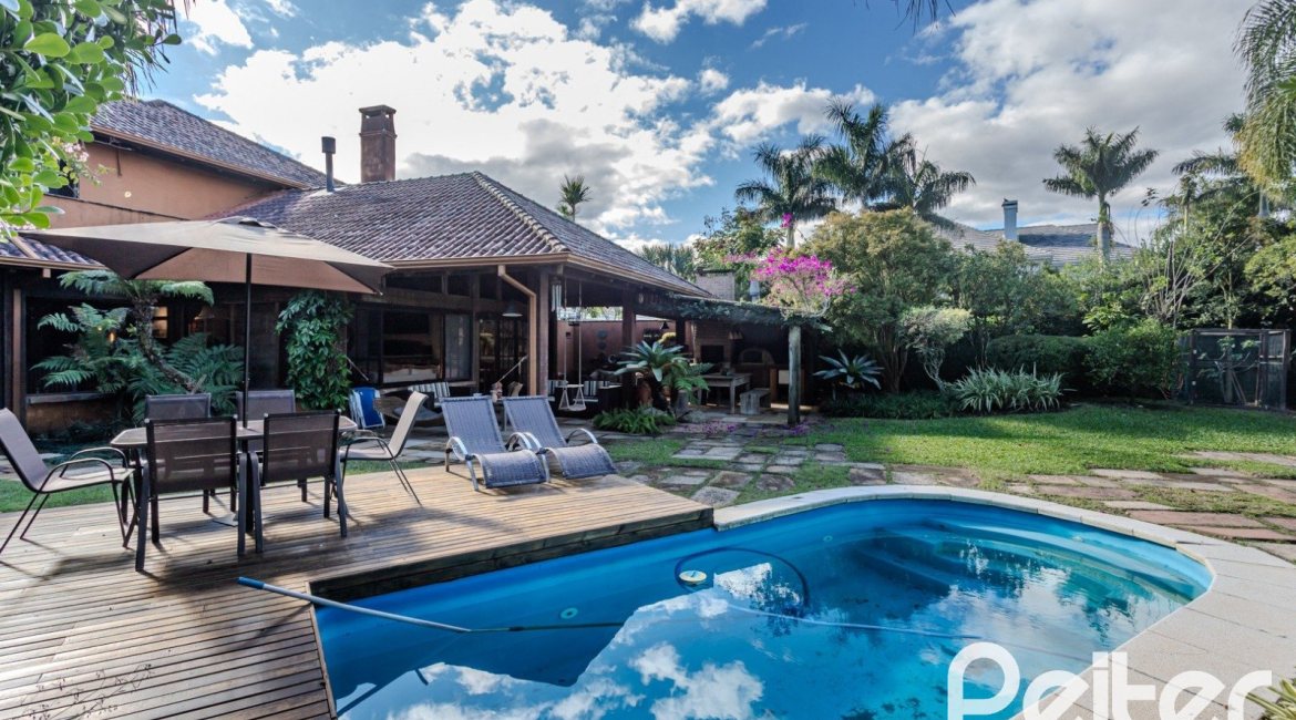 Casa em Condomínio à venda com 450m², 6 dormitórios, 4 suítes, 2 vagas, no bairro Terra Ville em PORTO ALEGRE