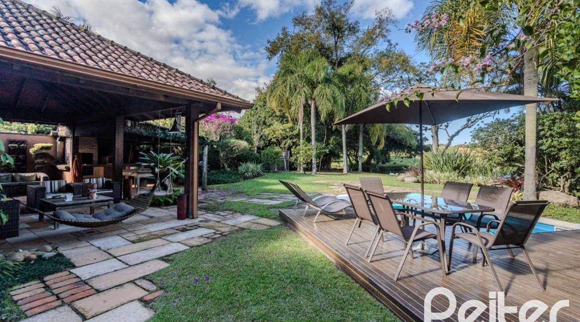Casa em Condomínio à venda com 450m², 6 dormitórios, 4 suítes, 2 vagas, no bairro Terra Ville em PORTO ALEGRE