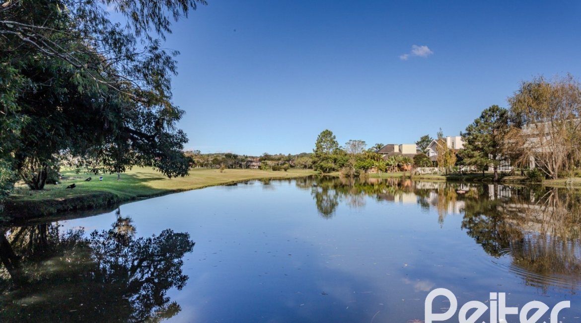Casa em Condomínio à venda com 450m², 6 dormitórios, 4 suítes, 2 vagas, no bairro Terra Ville em PORTO ALEGRE