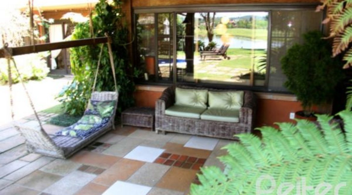 Casa em Condomínio à venda com 450m², 6 dormitórios, 4 suítes, 2 vagas, no bairro Terra Ville em Porto Alegre