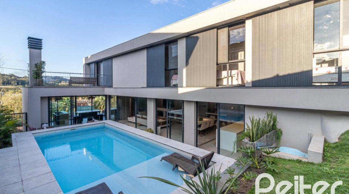 Casa em Condomínio à venda com 411m², 4 dormitórios, 4 suítes, 6 vagas, no bairro Alphaville em PORTO ALEGRE