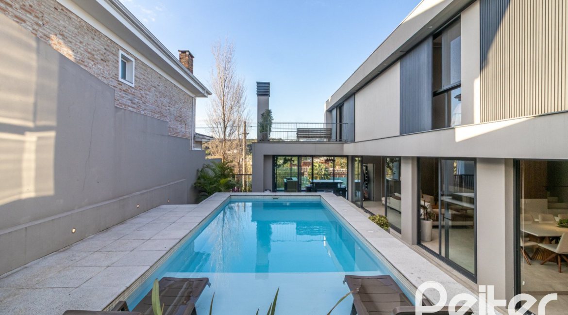 Casa em Condomínio à venda com 411m², 4 dormitórios, 4 suítes, 6 vagas, no bairro Alphaville em PORTO ALEGRE