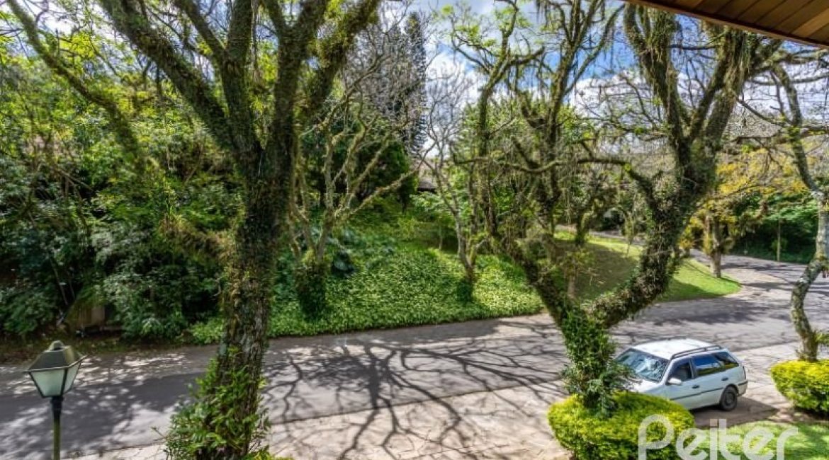 Casa em Condomínio à venda com 600m², 5 dormitórios, 5 suítes, 4 vagas, no bairro Cavalhada em Porto Alegre