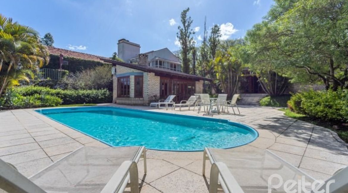 Casa em Condomínio à venda com 600m², 5 dormitórios, 5 suítes, 4 vagas, no bairro Cavalhada em Porto Alegre