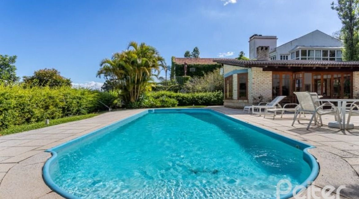 Casa em Condomínio à venda com 600m², 5 dormitórios, 5 suítes, 4 vagas, no bairro Cavalhada em Porto Alegre