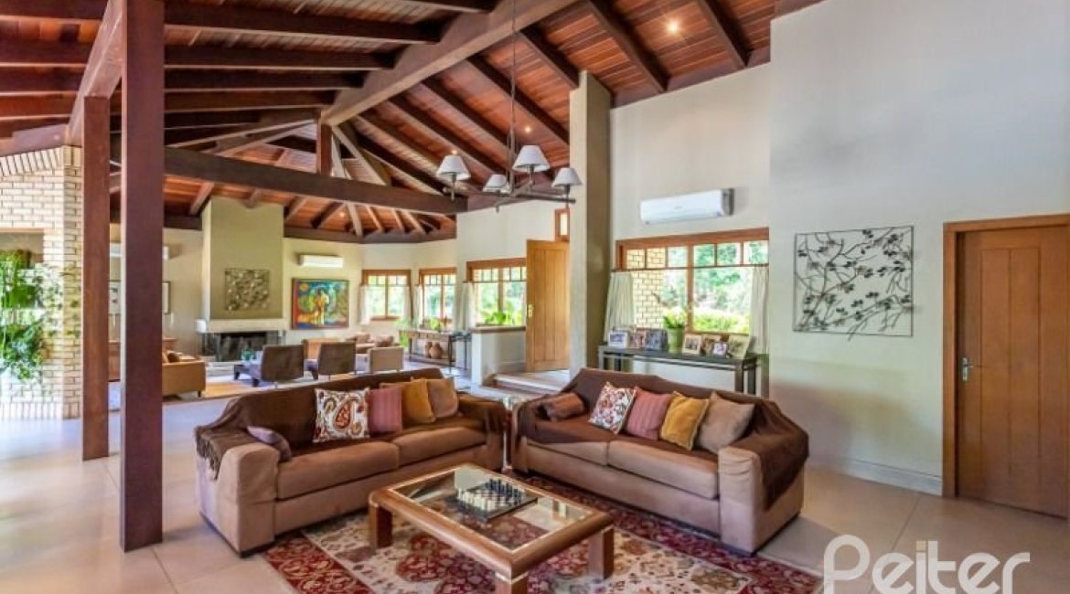 Casa em Condomínio à venda com 600m², 5 dormitórios, 5 suítes, 4 vagas, no bairro Cavalhada em Porto Alegre