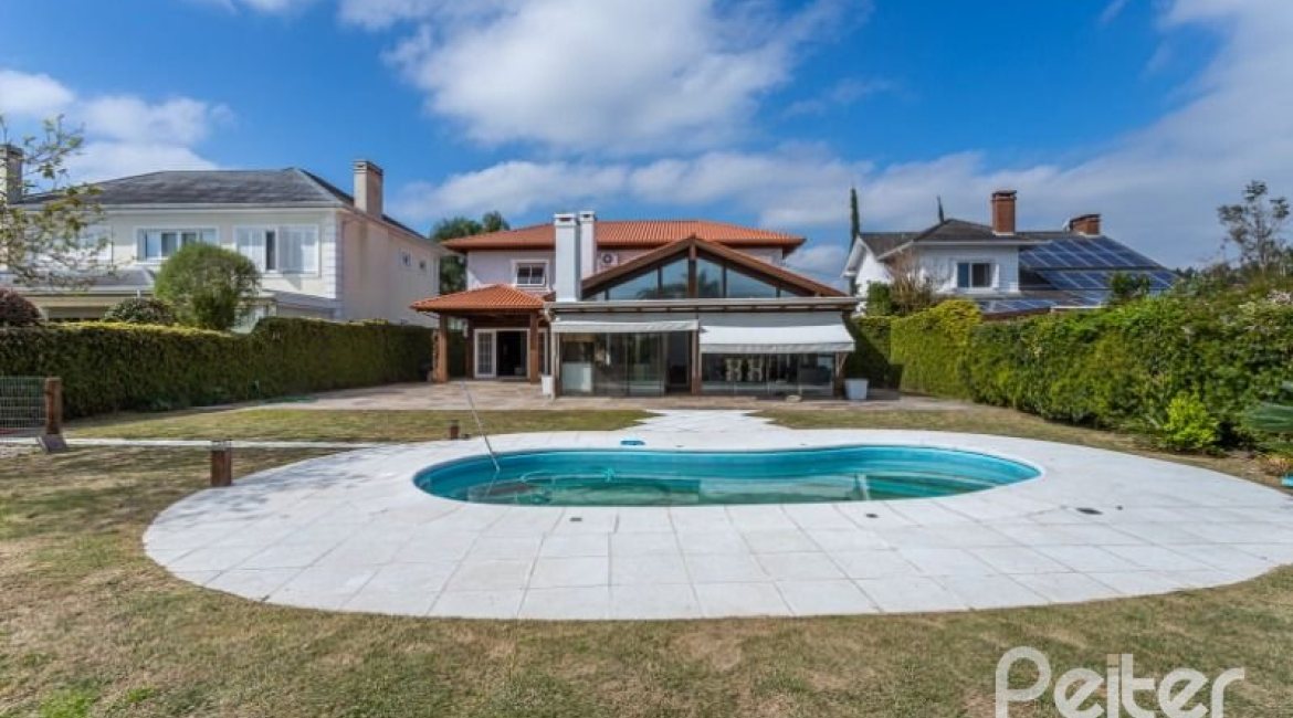 Casa em Condomínio à venda com 348m², 4 dormitórios, 2 suítes, 4 vagas, no bairro Terra Ville em PORTO ALEGRE