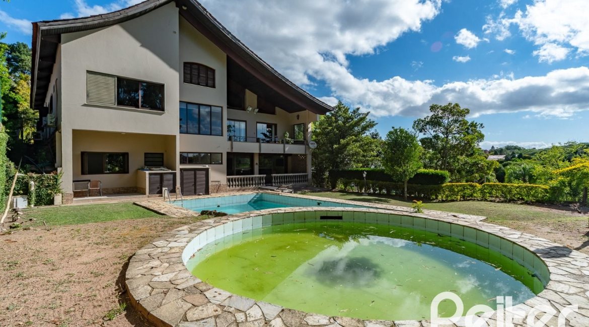 Casa em Condomínio à venda com 565m², 5 dormitórios, 3 suítes, 4 vagas, no bairro Cavalhada em Porto Alegre