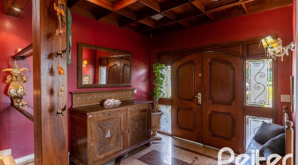 Casa em Condomínio à venda com 565m², 5 dormitórios, 3 suítes, 4 vagas, no bairro Cavalhada em Porto Alegre