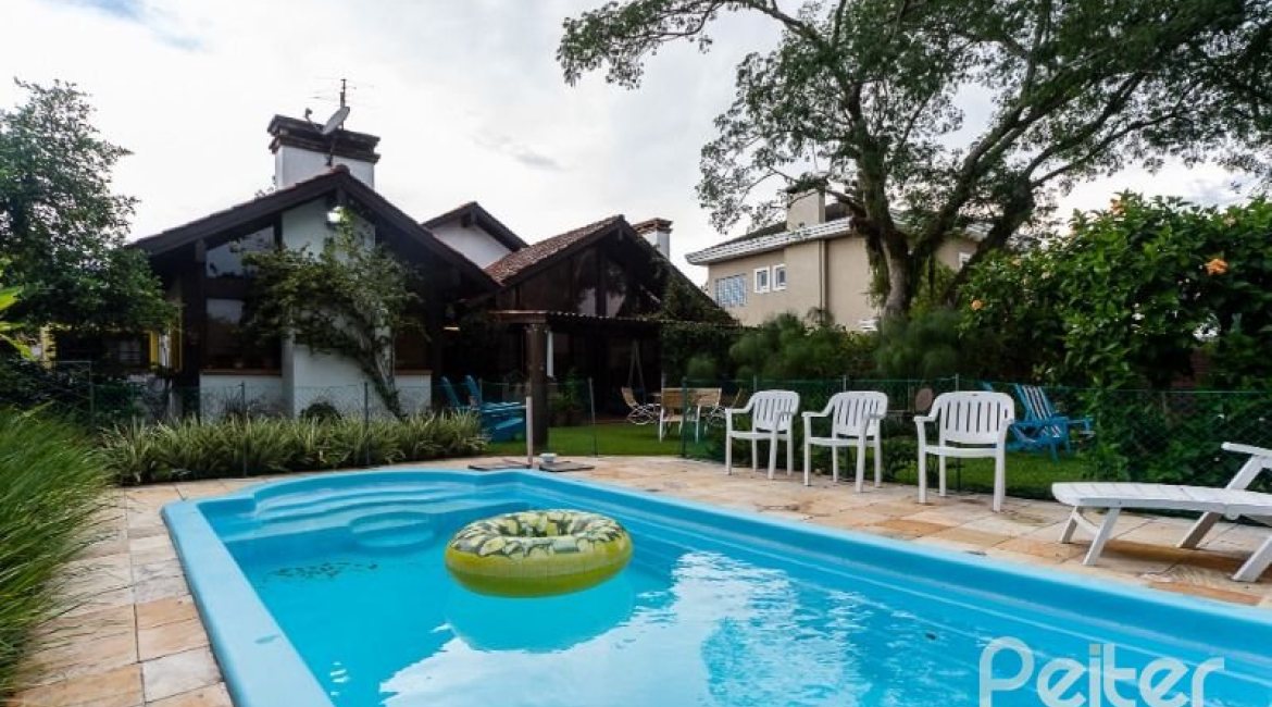 Casa em Condomínio à venda com 232m², 4 dormitórios, 1 suíte, 4 vagas, no bairro Terra Ville em PORTO ALEGRE