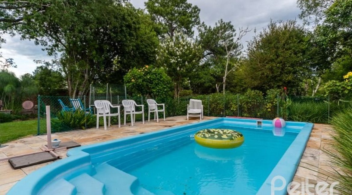 Casa em Condomínio à venda com 232m², 4 dormitórios, 1 suíte, 4 vagas, no bairro Terra Ville em PORTO ALEGRE