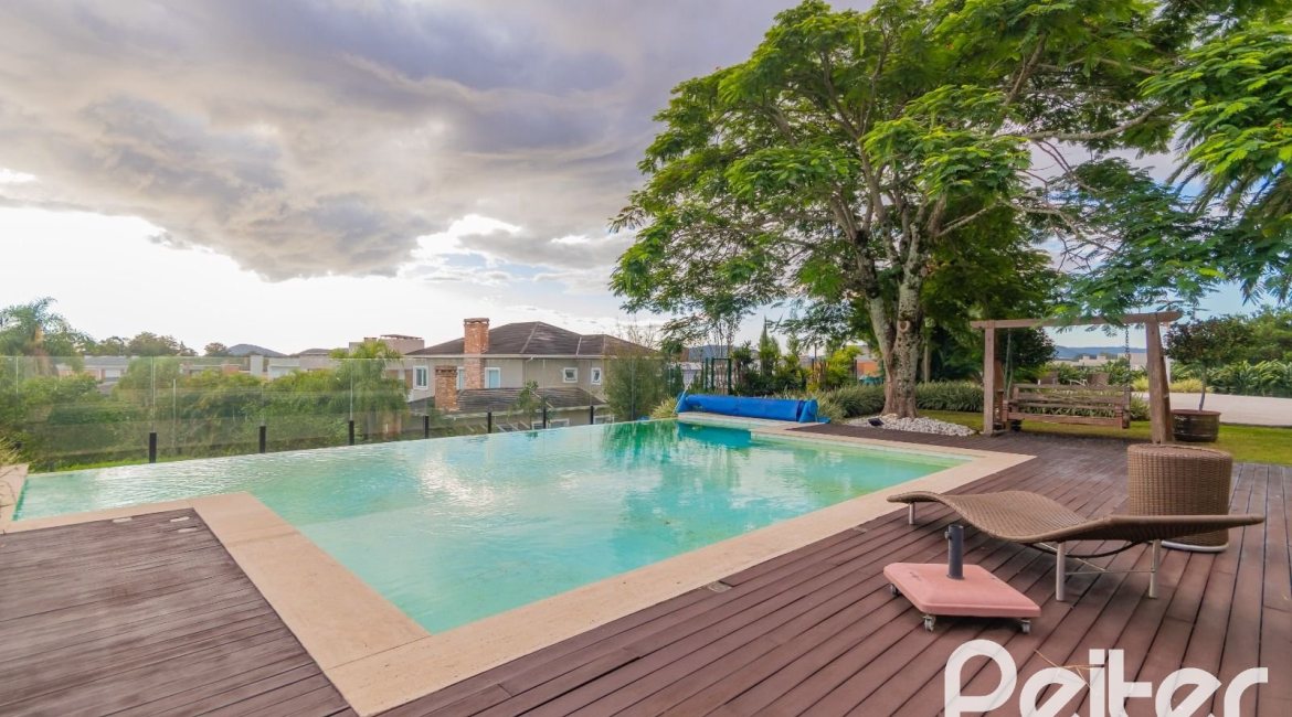 Casa em Condomínio à venda com 941m², 5 dormitórios, 5 suítes, 6 vagas, no bairro Terra Ville em PORTO ALEGRE