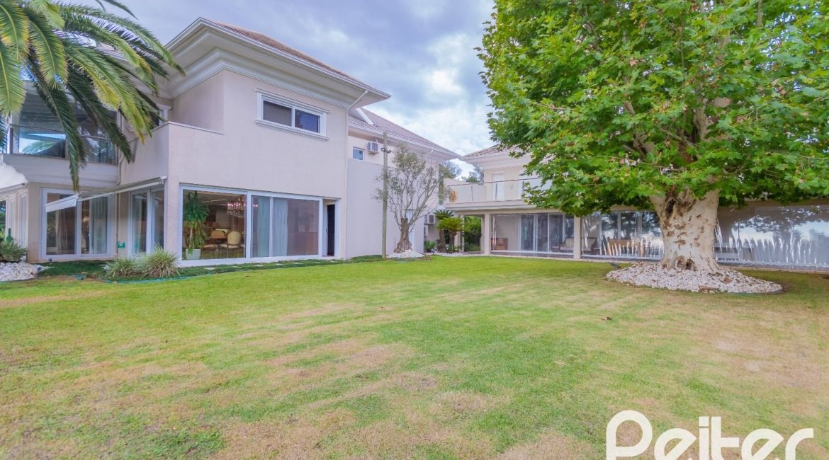 Casa em Condomínio à venda com 941m², 5 dormitórios, 5 suítes, 6 vagas, no bairro Terra Ville em PORTO ALEGRE