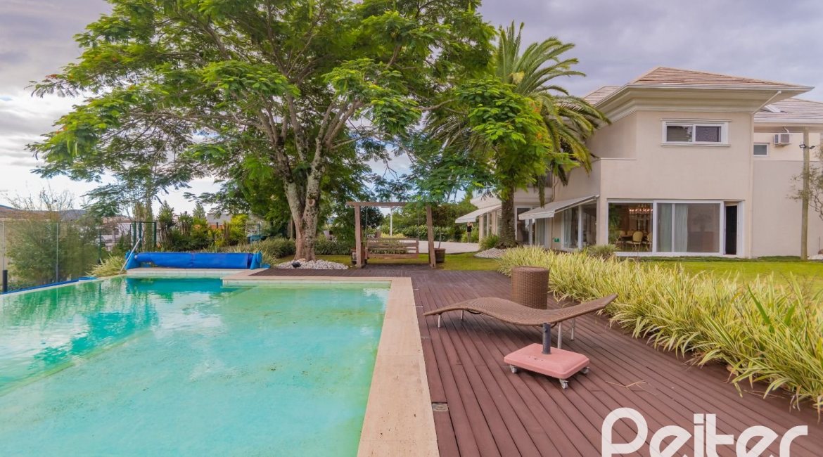Casa em Condomínio à venda com 941m², 5 dormitórios, 5 suítes, 6 vagas, no bairro Terra Ville em PORTO ALEGRE