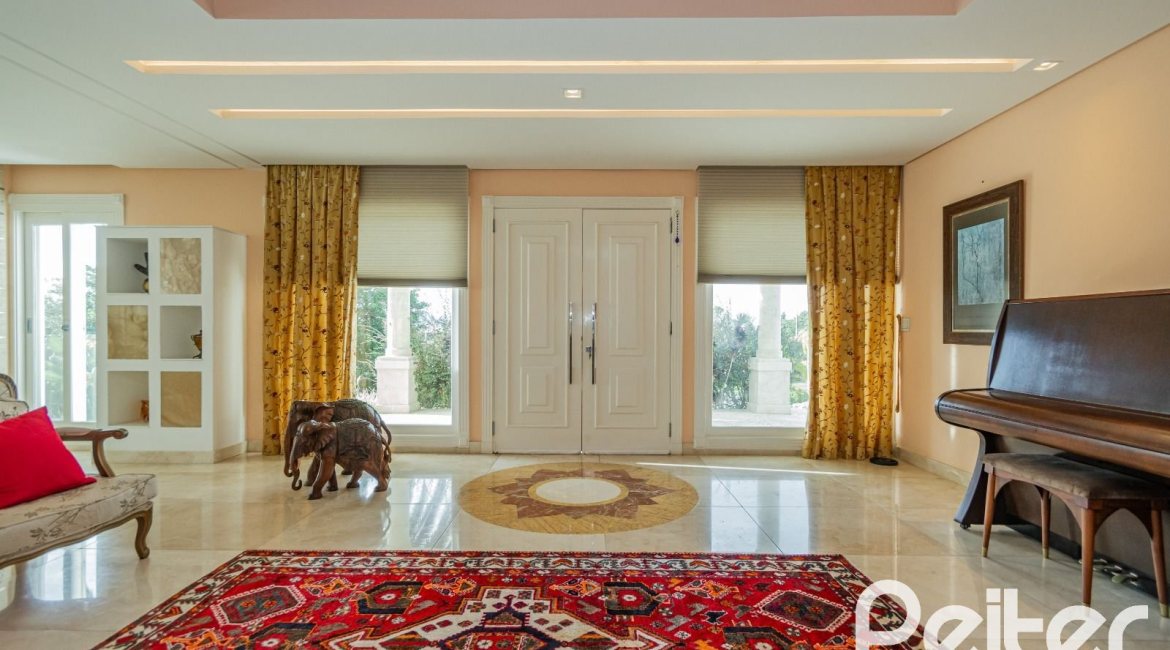 Casa em Condomínio à venda com 941m², 5 dormitórios, 5 suítes, 6 vagas, no bairro Terra Ville em PORTO ALEGRE