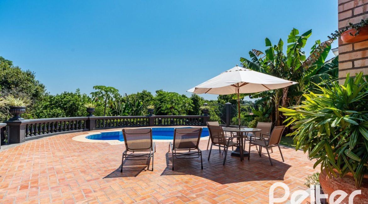 Casa em Condomínio à venda com 459m², 4 dormitórios, 4 suítes, 3 vagas, no bairro Cavalhada em PORTO ALEGRE